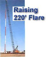 Raising the 220' Temporary Flare with Crane -- then attaching the guy wires to the deadweights